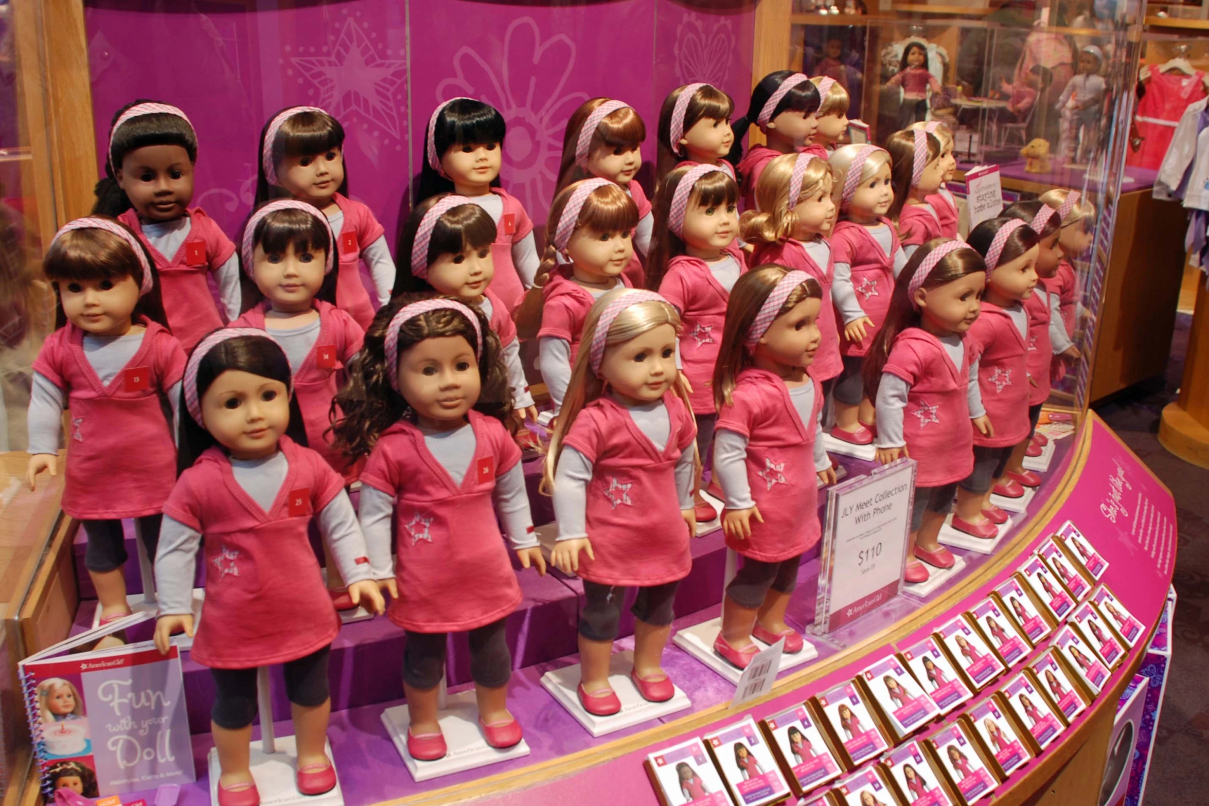 a display of dolls in a shop window