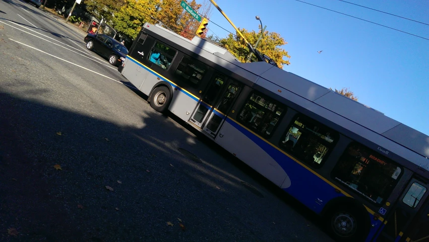 a city bus parked along the side of the street