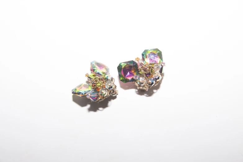 two pieces of colorful and shiny jewelry