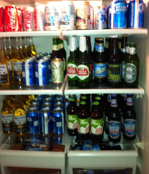 open fridge door showing many beers and drinks in it