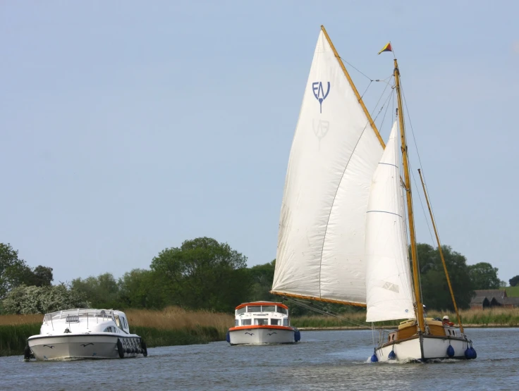 two boats in the water one is smaller than the other