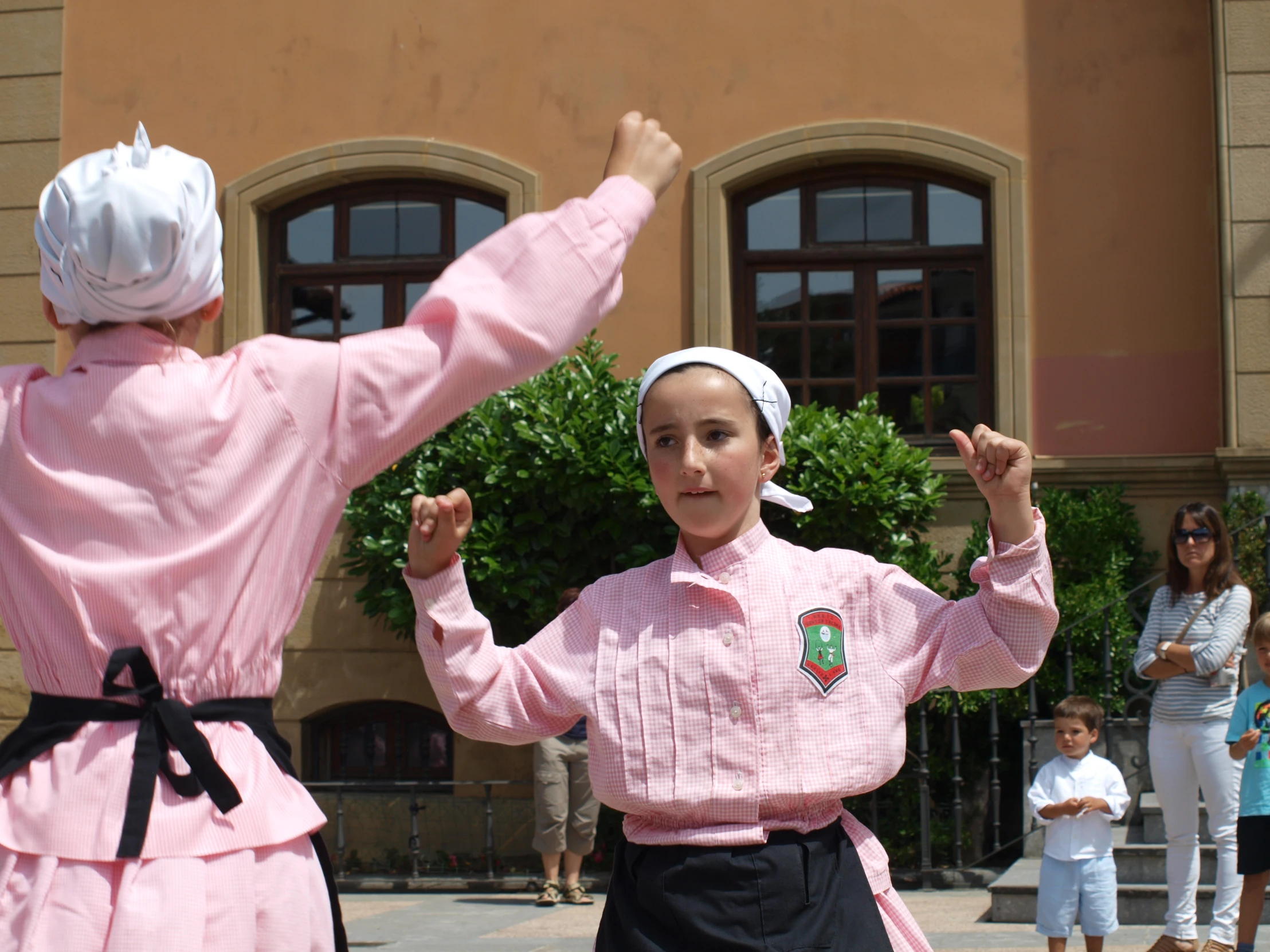 two people in costumes perform at an event