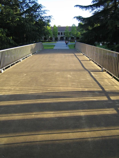 an empty bridge with shadows on the floor