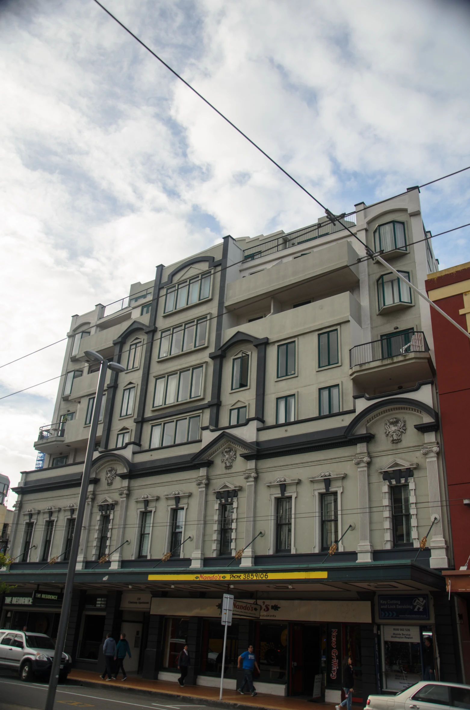 a street corner with a building next to it