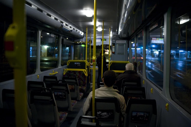 several people on the inside of a bus