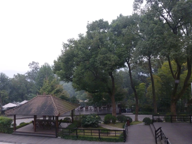 an outdoor area with some trees and buildings