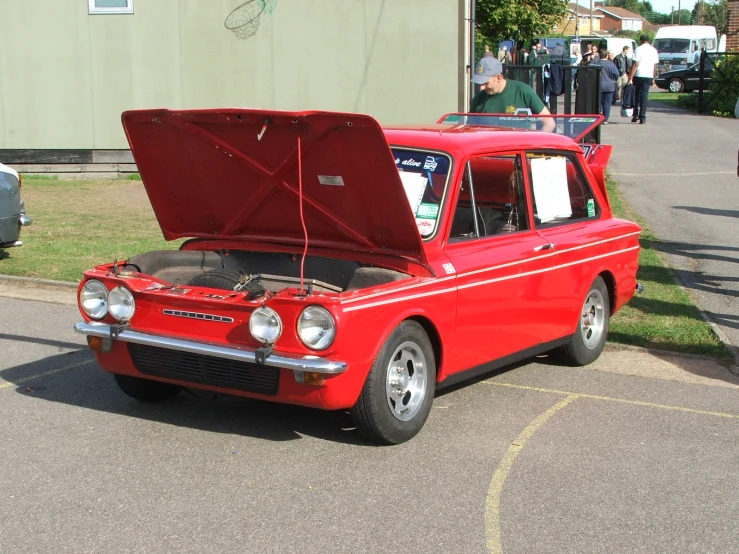 a car has its hood up and engine out