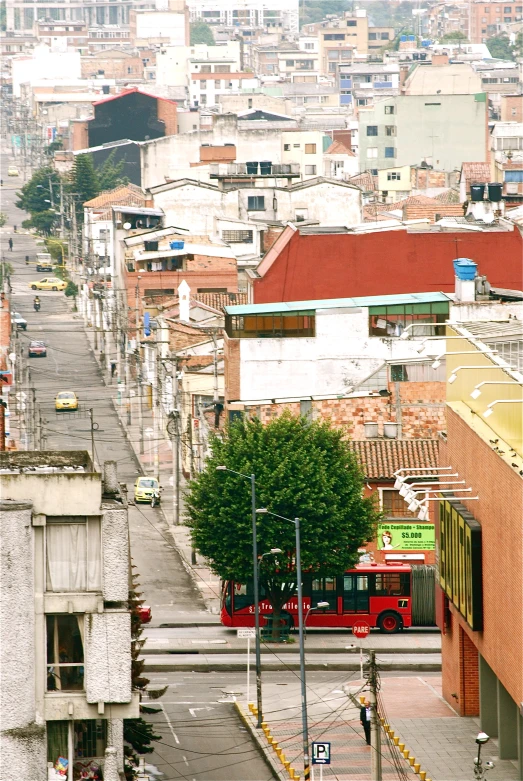 a red bus drives down an empty street