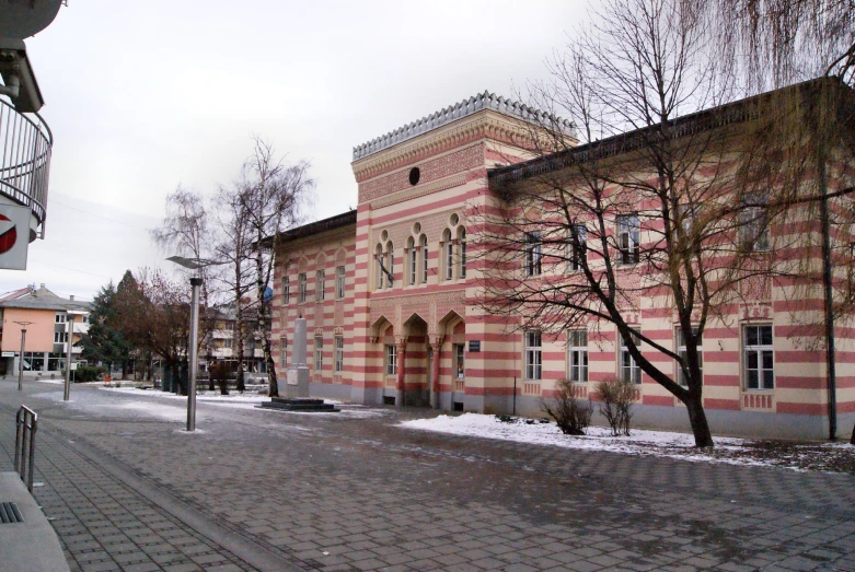 an old brick building sitting on a street corner