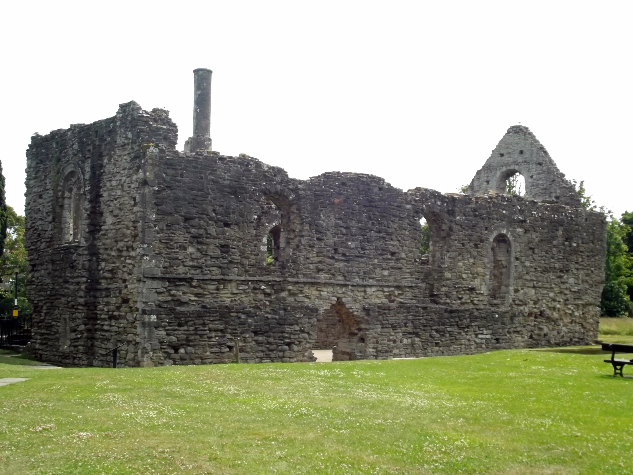 a stone castle with a bench near it