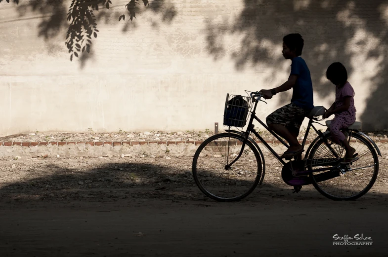 a man and  ride a bicycle