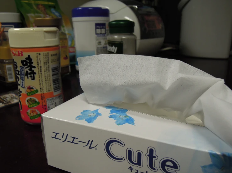 the tissue is in its new box with other boxes around it