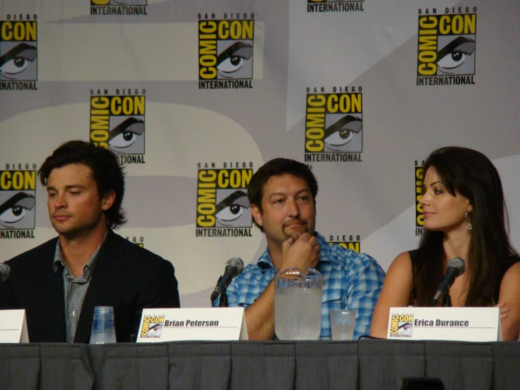 a number of actors sit together at a convention