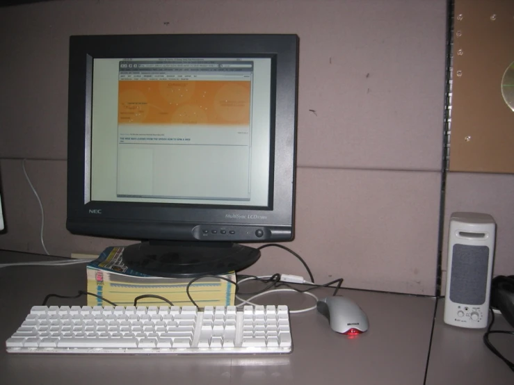 a computer on a desk with the mouse and keyboard