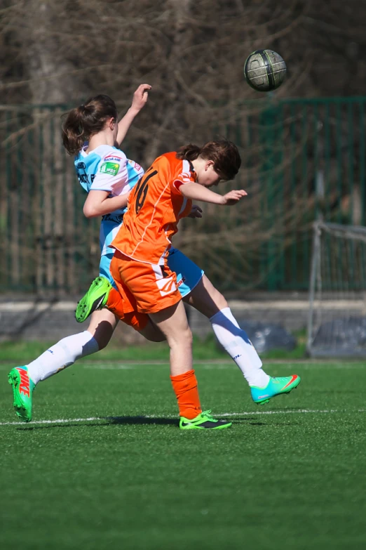 some children are playing soccer and they are fighting for the ball