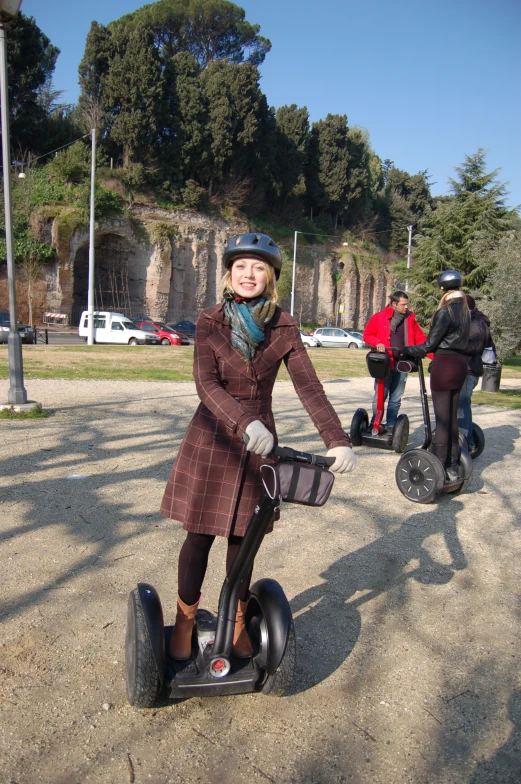 a girl on a segway is standing up