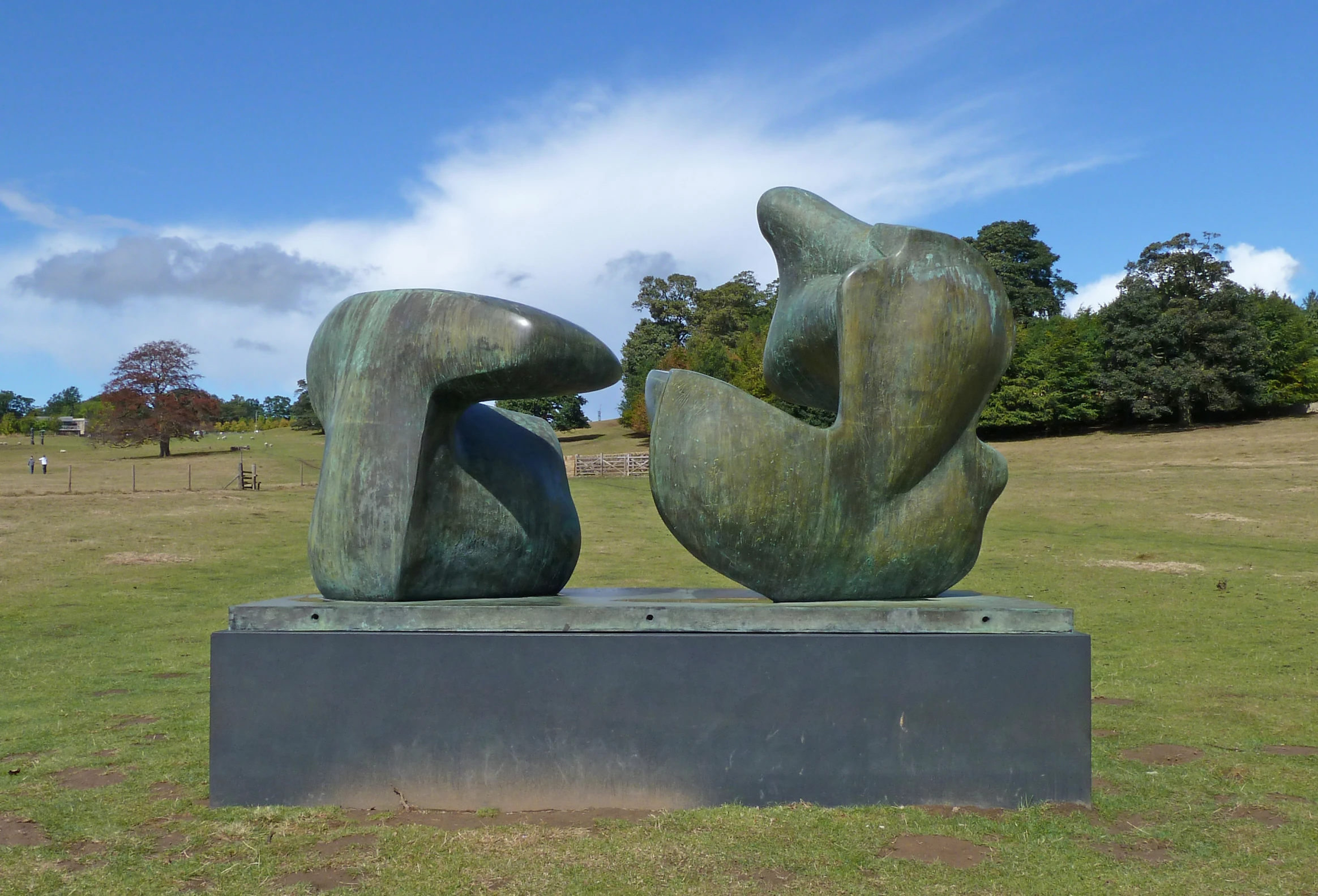 there is a statue on display in the field