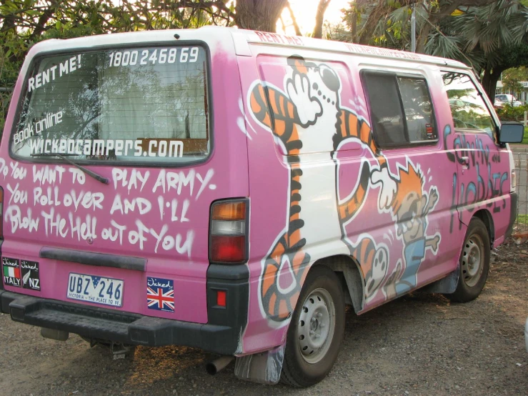 a pink van with tiger prints on it