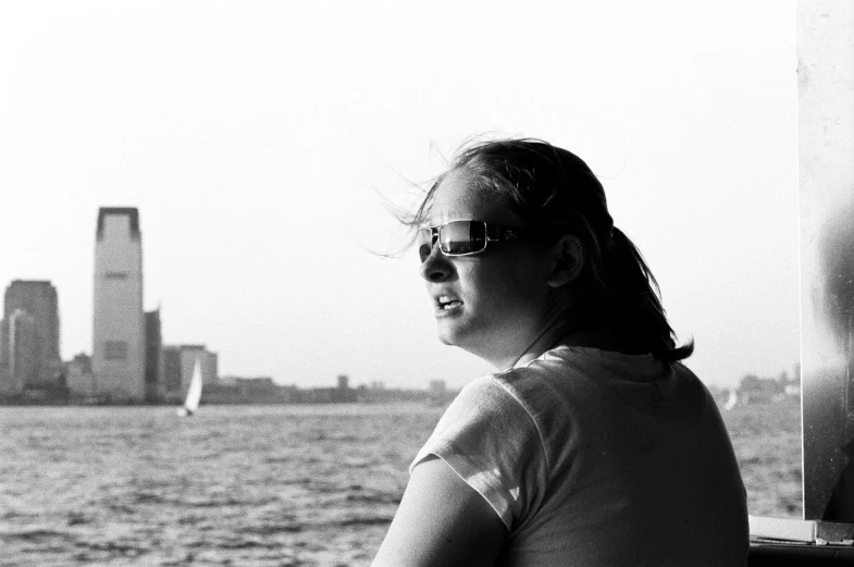 a woman wearing glasses is looking off into the distance