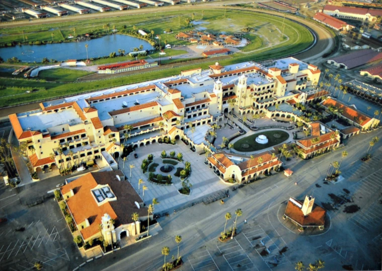 an aerial s of a large building and a body of water