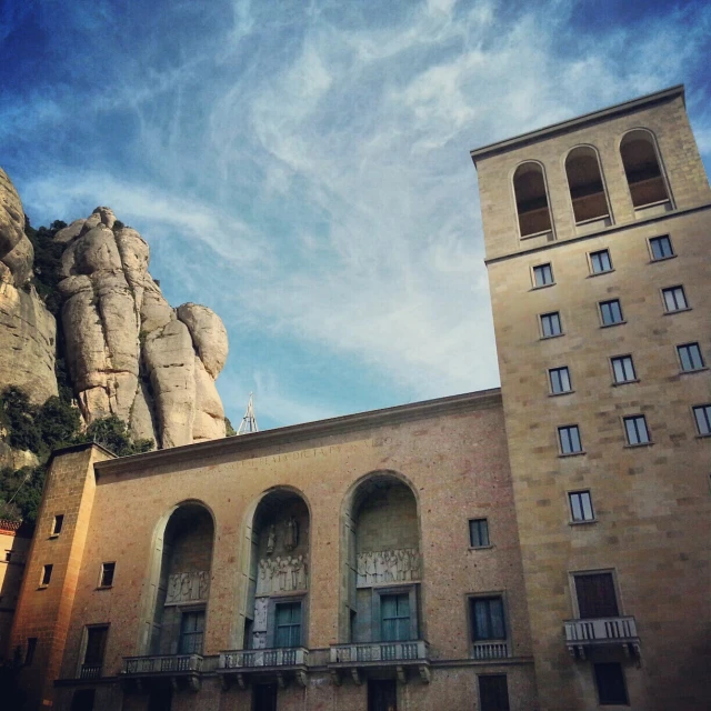 a couple of buildings and some statues behind them