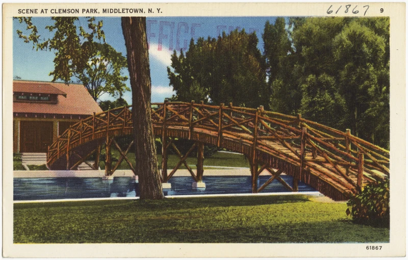 the back yard features a small bridge and pool