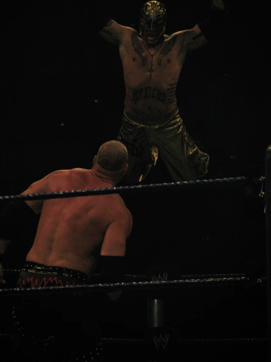two wrestlers fighting in a wrestling ring