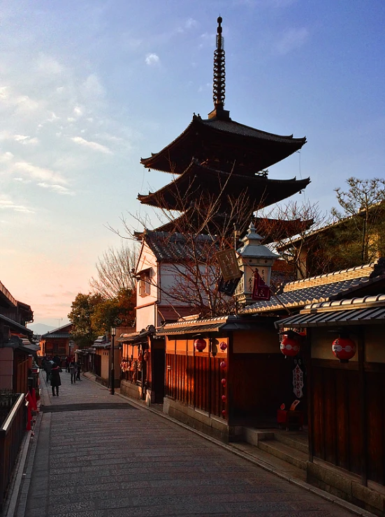 a view down a narrow street of pagodas