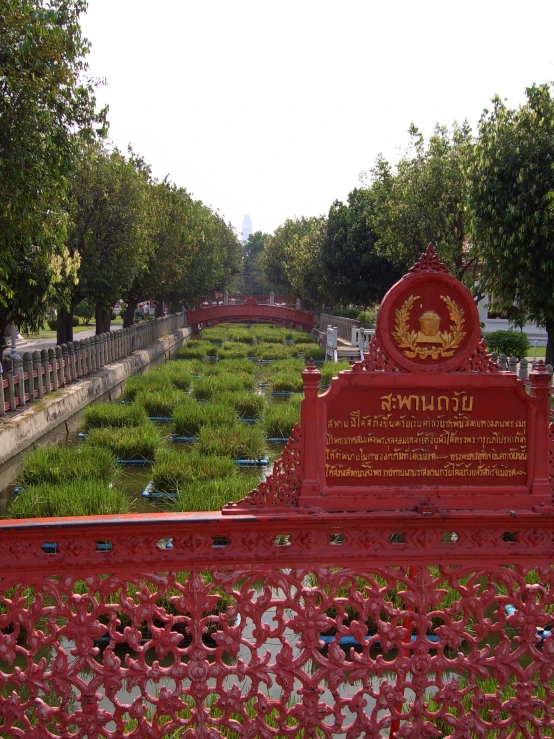 a park with some trees and small bridge