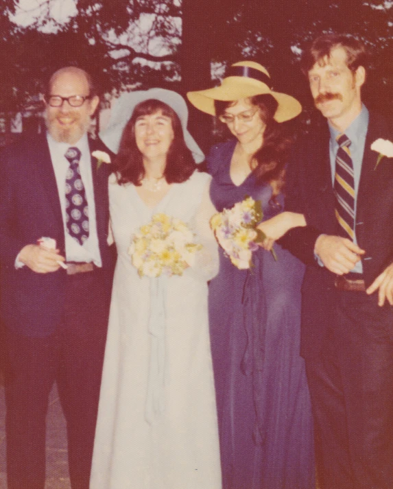 a group of people standing together at a wedding