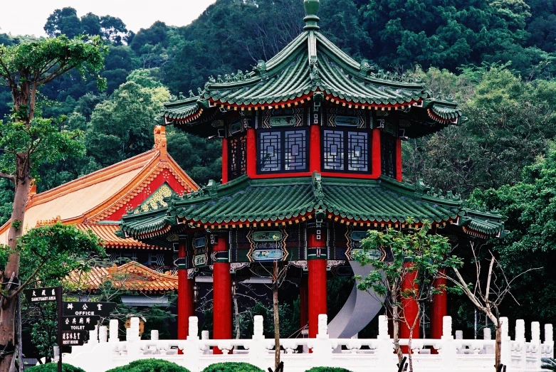 a chinese building with red columns on the side