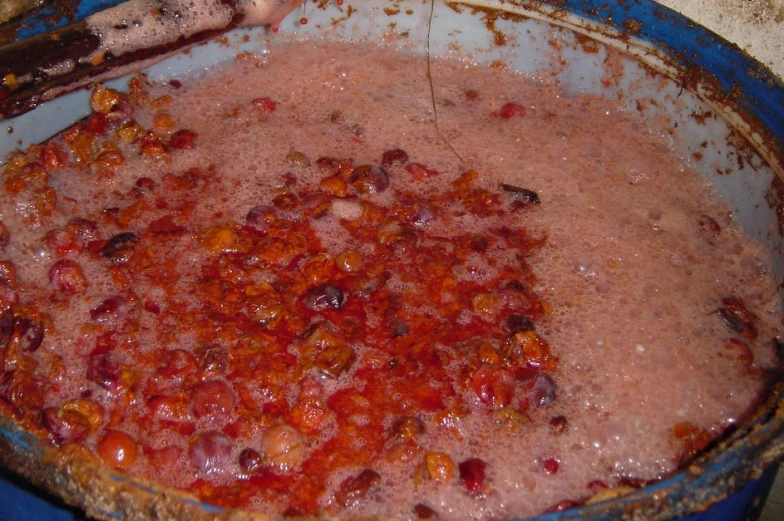 a pot of food containing fruit and flour