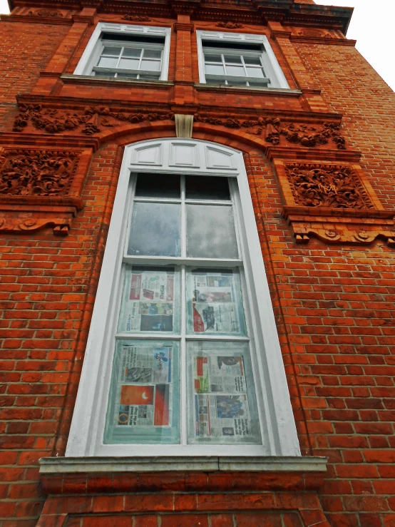 there is an old brick building with windows and red bricks