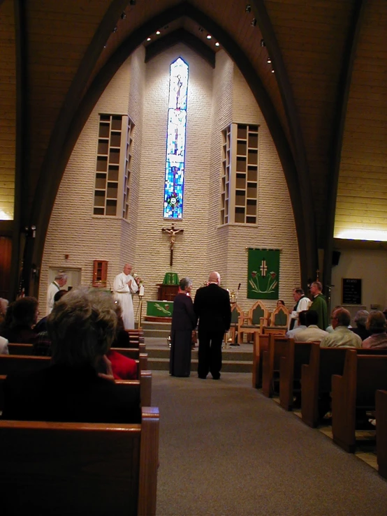 a group of people walking down the aisle