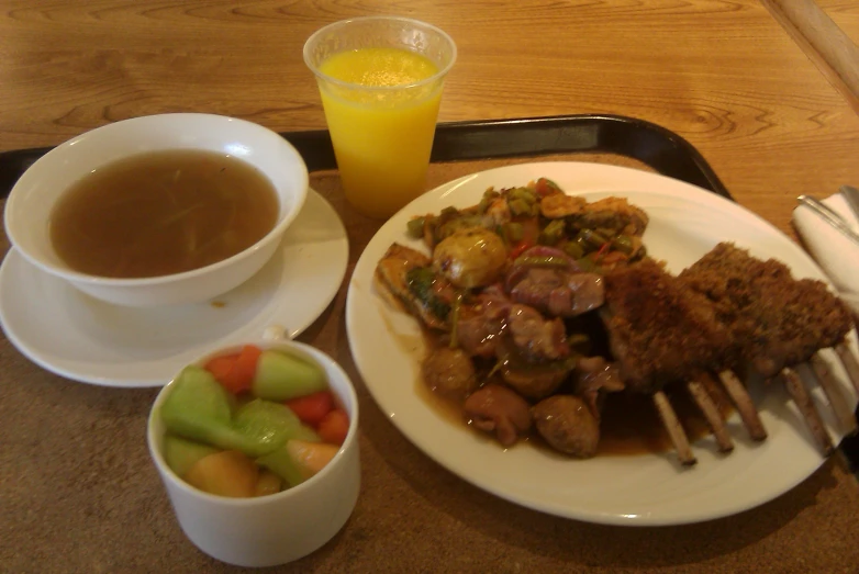 a plate with food that includes meat, potatoes and vegetable