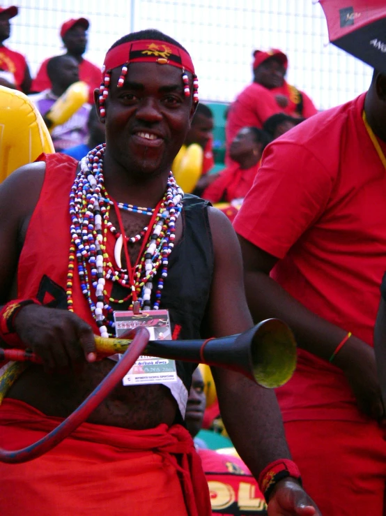 the man is dressed up and smiling for the camera