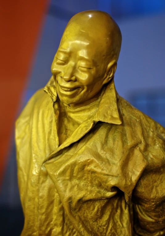 a statue of a man's head is smiling