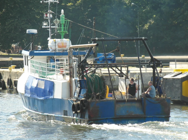 a blue and white boat is in the water