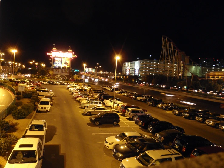 a large parking lot with a few cars on it