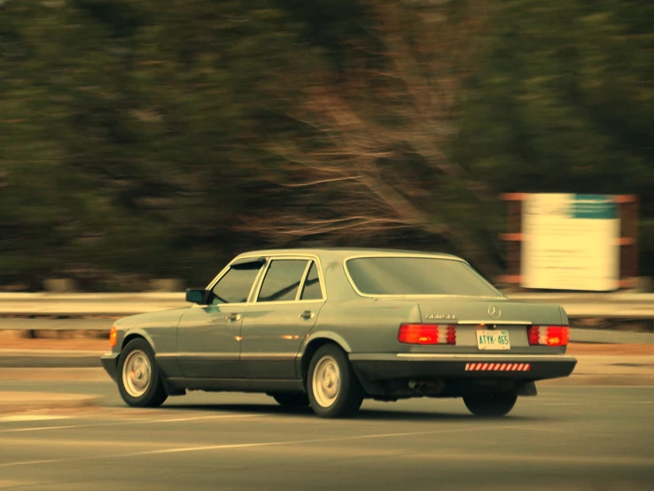 an automobile drives on the road in traffic