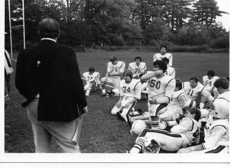 a team is gathered together on the field