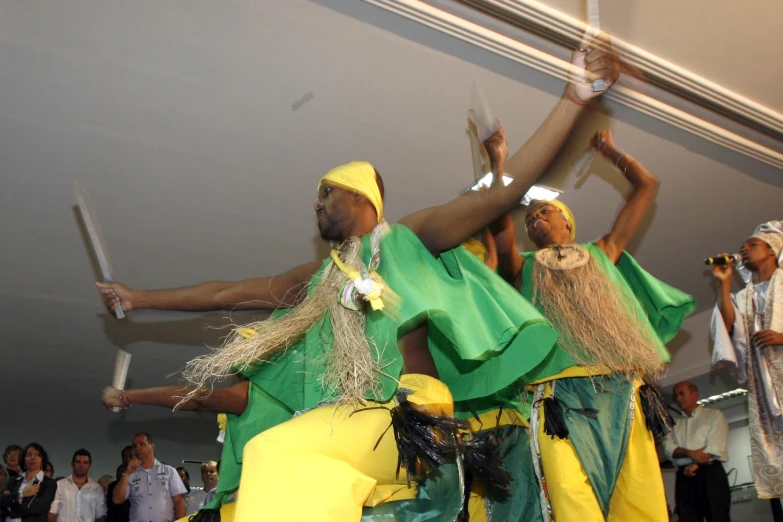 a group of people that are standing up with some swords