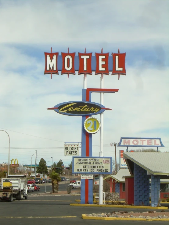 a motel sign has been painted bright colors