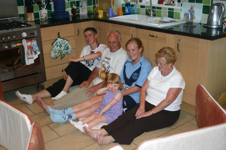 an image of some family in the kitchen