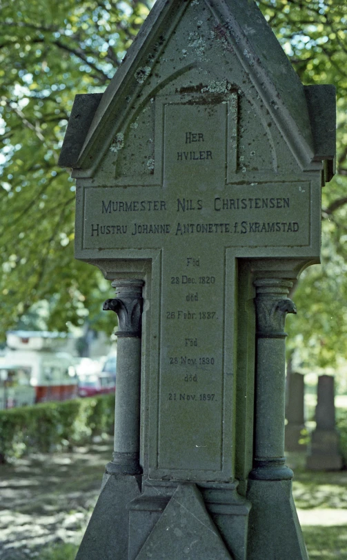 a monument sits in the middle of a park