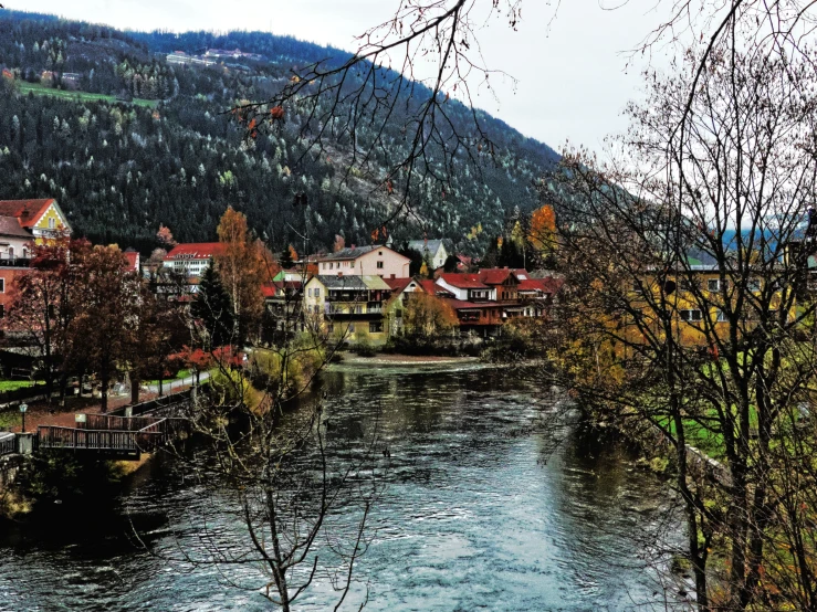 a view of a river running through a small town