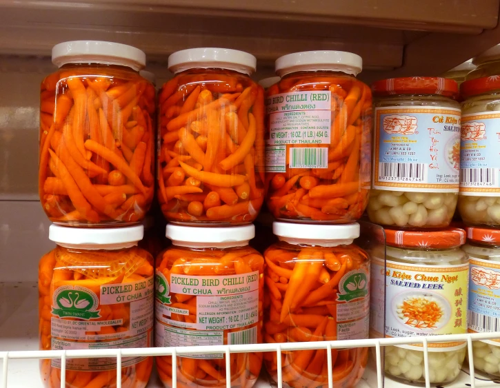 a collection of jars and spoons that contain carrot peels