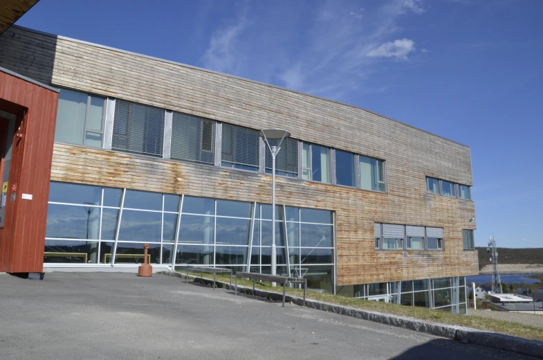 large multi - story building with modern glass and wood architecture