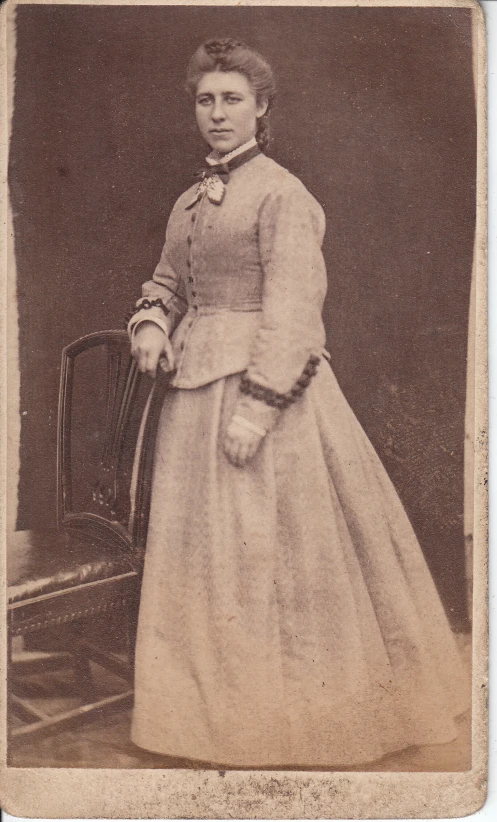 old fashion pograph of a woman with large dress