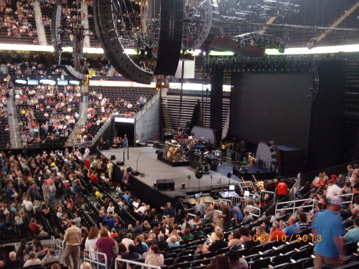 a packed arena filled with people during a concert